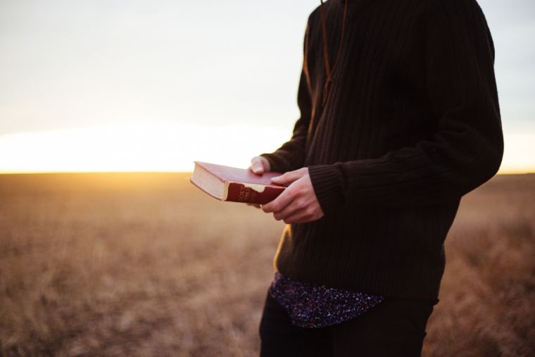 man-holding-bible