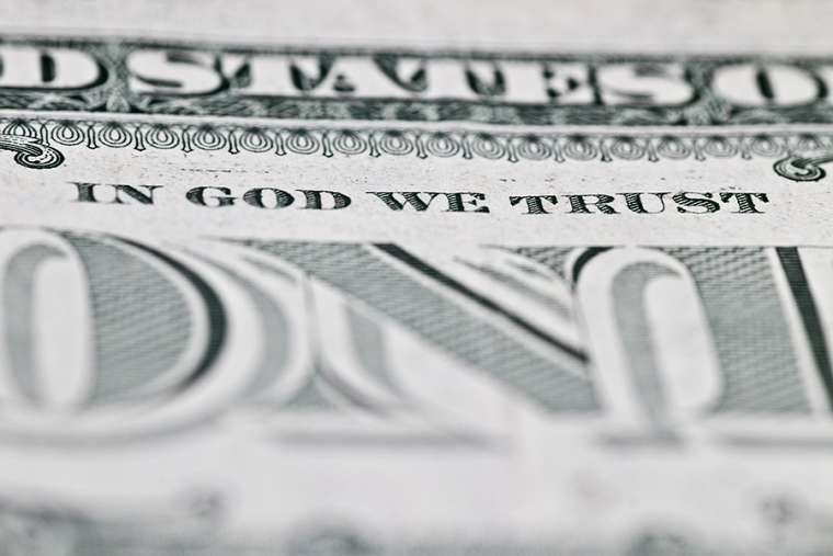 in_god_we_trust_dollar_bill_credit_mohamed_monem_shutterstock_cna