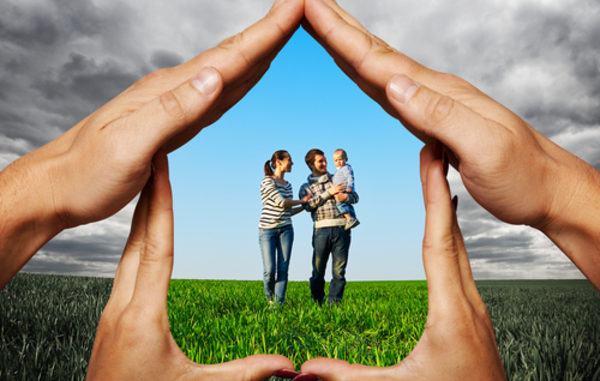hands-showing-house-with-family-600x381