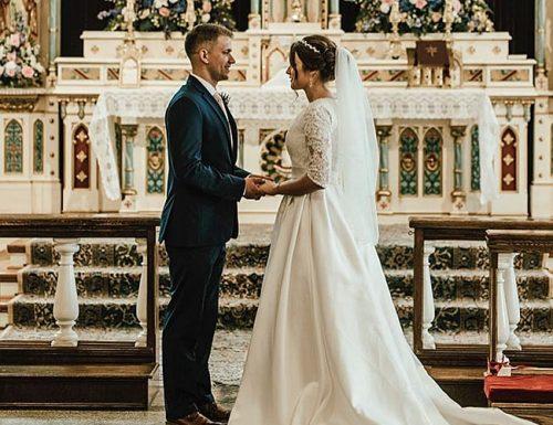 catholic-wedding-vows-newlyweds-at-the-church-juliananoellejumper-min-500x385